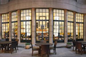 a group of tables and chairs in front of a building at Westin Georgetown, Washington D.C. in Washington, D.C.