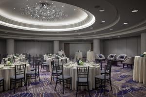 a banquet room with tables and chairs and a chandelier at Westin Georgetown, Washington D.C. in Washington, D.C. +88 photos