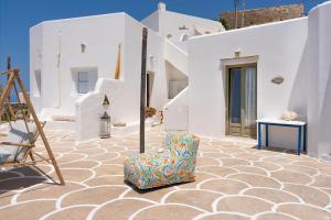 a suitcase sitting on the side of a building at Sifnos in Sikinos
