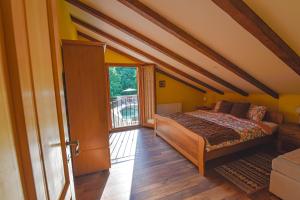a bedroom with a bed and a large window at Villa Danica with pool - Perka in Zvoneće +26 photos