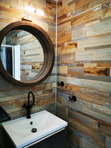 a bathroom with a sink and a mirror at Escapade charentaise in Aigrefeuille-dʼAunis +23 photos