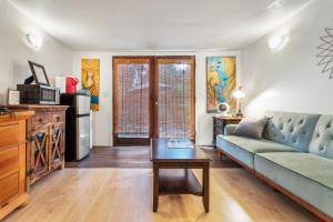 a living room with a couch and a table at Private Studio City Guest House in Los Angeles