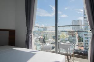 Ένα ή περισσότερα κρεβάτια σε δωμάτιο στο The Gold Coast Hotel Nha Trang +71 φωτογραφίες