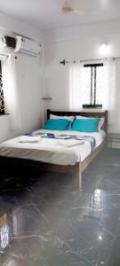 מיטה או מיטות בחדר ב-Green House Stay