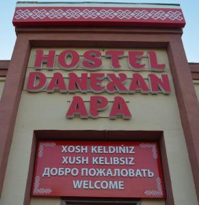 a sign for a houston damedanarmaarmaarmaarma at Hostel DANEXAN APA in Nukus