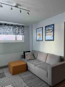 a living room with a couch and a coffee table at One bedroom apartment in central Savonlinna in Savonlinna