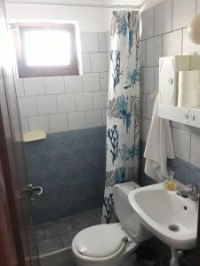 a bathroom with a toilet and a sink at STUDIO ILIANA in Samos