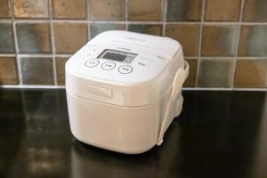 a white toaster sitting on top of a counter at Oyado Kawaramachi Gojo（御宿 河原町五条） in Kyoto