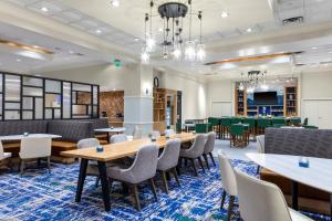 a large room with tables and chairs and a classroom at Residence Inn Denver City Center in Denver