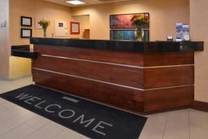 a welcome sign at a welcome desk in a lobby at Residence Inn by Marriott Dayton Troy in Troy
