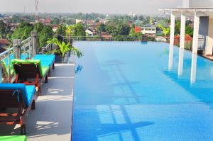 a large swimming pool on the roof of a building at Pandanaran Prawirotaman Yogyakarta in Yogyakarta