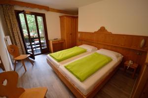 Letto o letti in una camera di Hotel Cime D'Oro