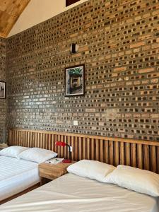Ένα ή περισσότερα κρεβάτια σε δωμάτιο στο Villa Đường Lâm- Sơn Tây