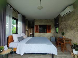 Voodi või voodid majutusasutuse Vieng pua homestays toas
