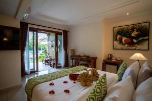 Ένα ή περισσότερα κρεβάτια σε δωμάτιο στο Capung Cottages +99 φωτογραφίες