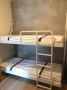 מיטה או מיטות בחדר ב-Alpendomizil Pia