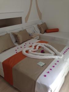 Postel nebo postele na pokoji v ubytování Doc's Hotel Kemer
