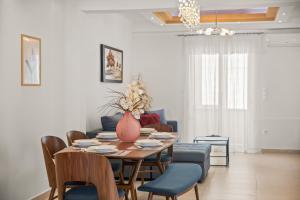 a dining room with a table and chairs at Rhodian Filoxenia in Rhodes Town