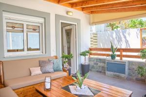 a living room with a couch and a table at Rhodian Filoxenia in Rhodes Town