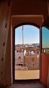 a window in a room with a view of the ocean at Lamar Guesthouse - Hebron in Hebron