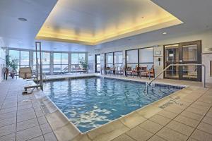a large indoor swimming pool in a building at Courtyard by Marriott Harrisburg West/Mechanicsburg in Mechanicsburg