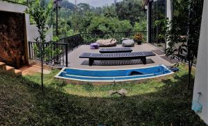 a group of benches sitting on a patio at Bellaxy Ceylon in Ella