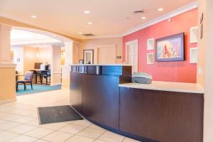 a lobby of a hospital with a reception counter at Residence Inn Holland in Holland