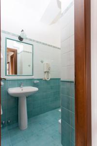 a bathroom with a sink and a mirror at Residence Marina Corta in Lipari
