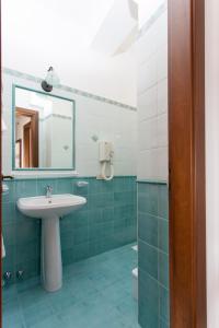 a bathroom with a sink and a mirror at Residence Marina Corta in Lipari +53 photos