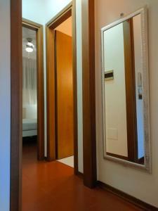 a hallway with two doors and a mirror at bilocale in residence CIR 017067-LNI-00151 in Desenzano del Garda