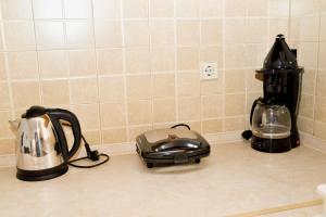 a kitchen counter with a toaster and a blender at ANTONIOS apartments in Archangelos