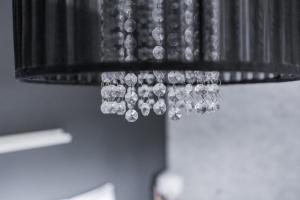 a close up of a chandelier with diamonds on it at Arctic Holiday Apartments 3 in Rovaniemi