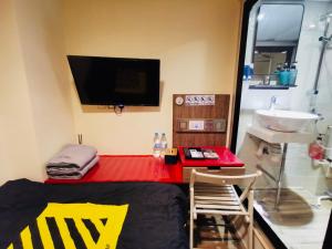 TV a/nebo společenská místnost v ubytování 香港九巴旅馆 KMB-Guesthouse