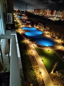 a view of a river at night from a building at Porto golf marina ,2 bedrooms , Families only in El Alamein