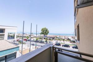a balcony with a view of a parking lot at Jungle Breeze in Pescara