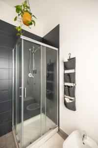 a glass shower in a bathroom with a sink at Spazio Ancora appartamento a 500 m. dal mare in Rimini