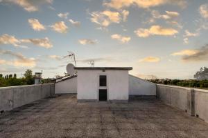 a small white building on top of a roof at Spazio Ancora appartamento a 500 m. dal mare in Rimini