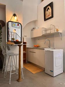 a small kitchen with a sink and a dishwasher at Amazing private loft apartment, Tel Aviv Jaffa in Tel Aviv