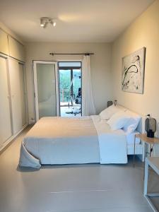 Posteľ alebo postele v izbe v ubytovaní Casa La Gavina Blanca