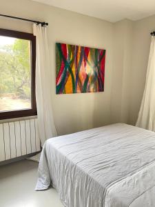 Posteľ alebo postele v izbe v ubytovaní Casa La Gavina Blanca