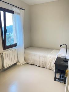 Posteľ alebo postele v izbe v ubytovaní Casa La Gavina Blanca