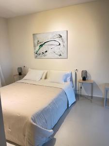 Posteľ alebo postele v izbe v ubytovaní Casa La Gavina Blanca