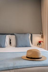 a hat is sitting on top of a bed at Geonature in Macedo de Cavaleiros