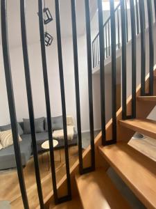 a staircase with black railings in a room at Noclegi u Wojtka in Sromowce Wyżne