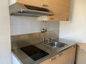 a small kitchen with a sink and a stove at Residence Playa in Tortoreto Lido