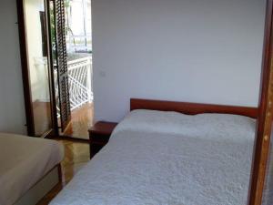 Postel nebo postele na pokoji v ubytování Apartments Đerek Pisak