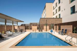a swimming pool on the roof of a building at Courtyard by Marriott Las Cruces at NMSU in Las Cruces
