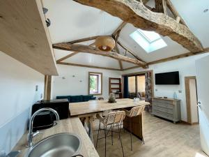 a kitchen with a counter and a sink in a room at Gite de Carbonade in Pailloles