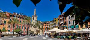 a city street with a church in the background at Vakantiehuisje op park Ippotur in Castelnuovo Magra