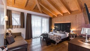 Postel nebo postele na pokoji v ubytování Hotel Ciasa Soleil